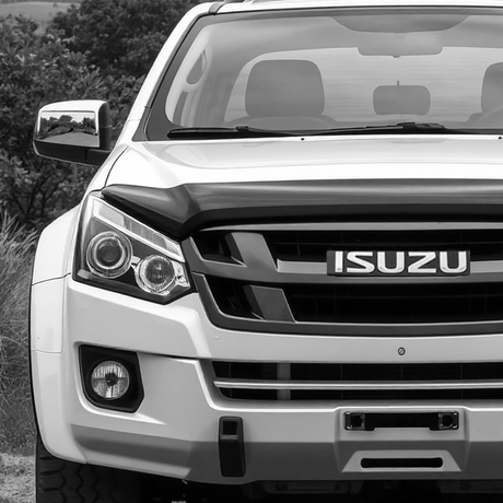 Close-up of a Isuzu D-max vehicle front, highlighting the grille and bumper, reflecting Brute Status's aftermarket accessory focus for pick-up trucks.