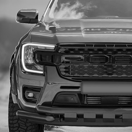 Front view of a car showcasing its grille and bumper, reflecting Brute Status's focus on aftermarket accessories and custom automotive designs.