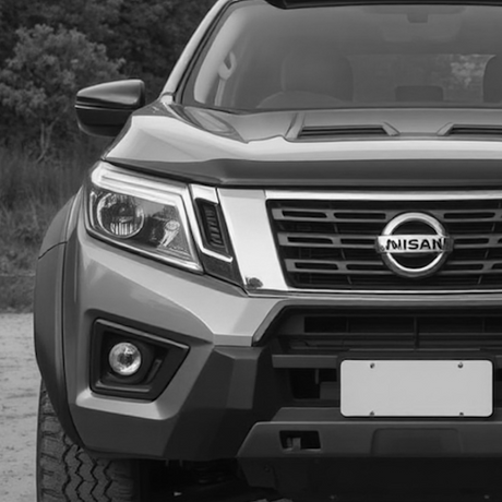 Front view of a black SUV showcasing its grille and bumper, ideal for customization enthusiasts looking for aftermarket enhancements at Brute Status.