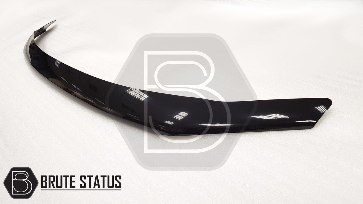 VW Amarok 2010-2022 Bonnet Guard Stone Deflector/Protector on a white surface, showcasing its aerodynamic design and protective features against bugs and stones.