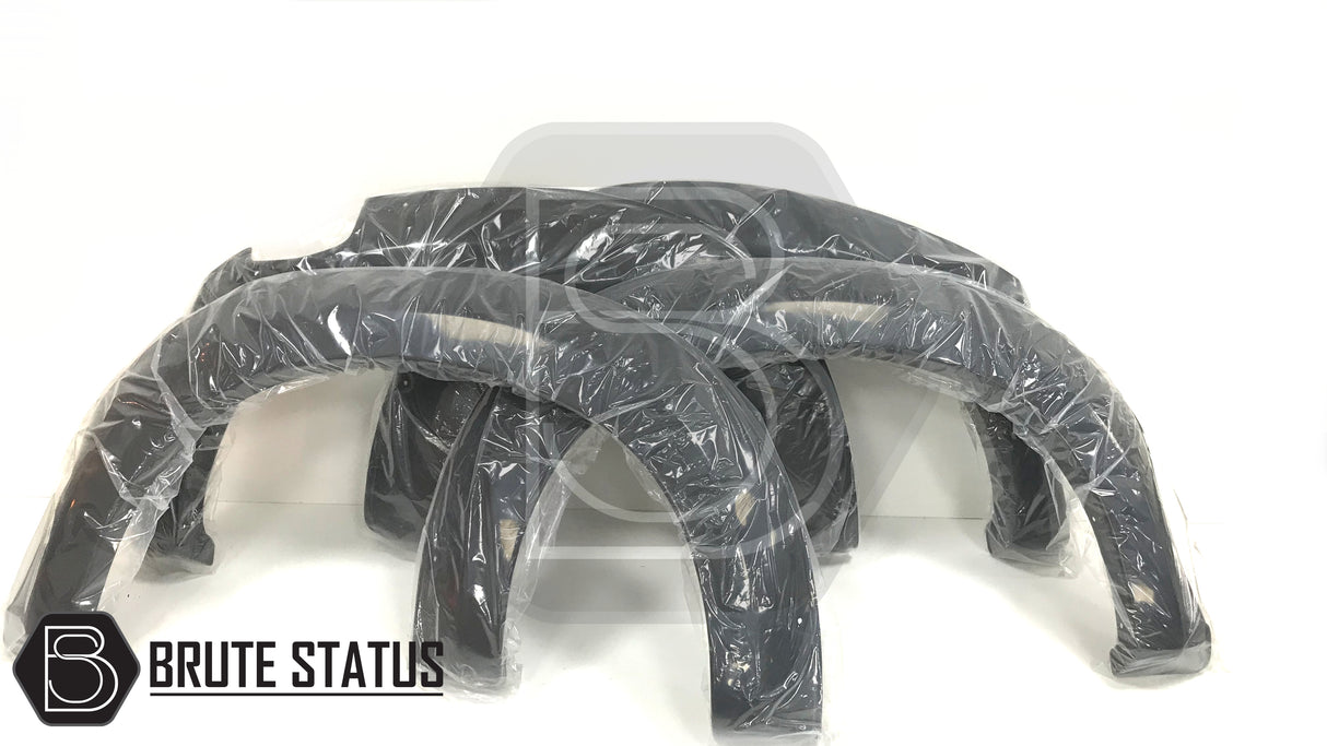 Isuzu D-Max 2012-2015 Wide Arch Kit, black fender flares wrapped in plastic, designed for double cab models, includes stainless steel fasteners and 3M tape.