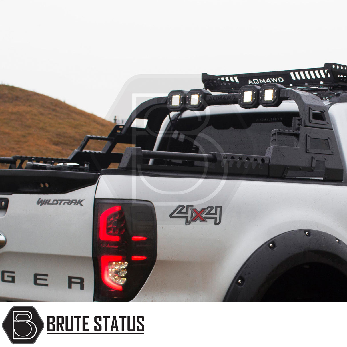 Matte black carbon steel heavy duty roll bar fitted to white Ford Ranger pickup truck offroad 4x4 vehicle, suitable for overlanding set ups. 