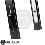 Close-up of Brute Status branded ARB Altitude Tent Ladder Extension's adjustable telescoping metal support legs with locking levers and plastic feet for rooftop tent use.