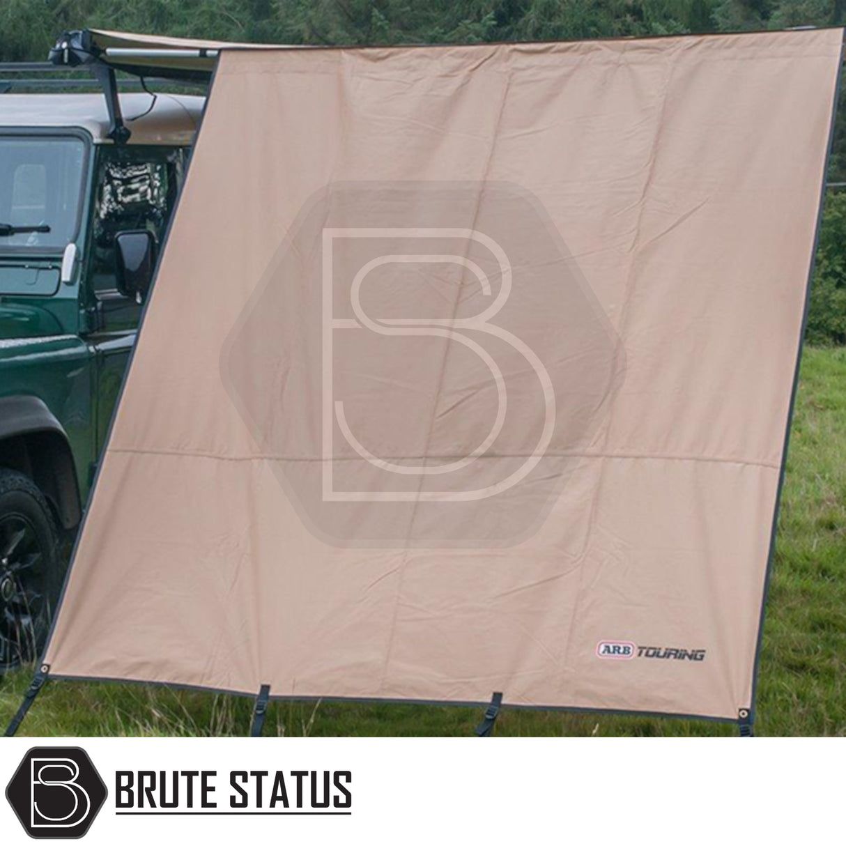 ARB Awning Wind Break attached to vehicle awning, pegged as a windbreak/sunshade, ideal for enhancing protection and space for off-road adventures.