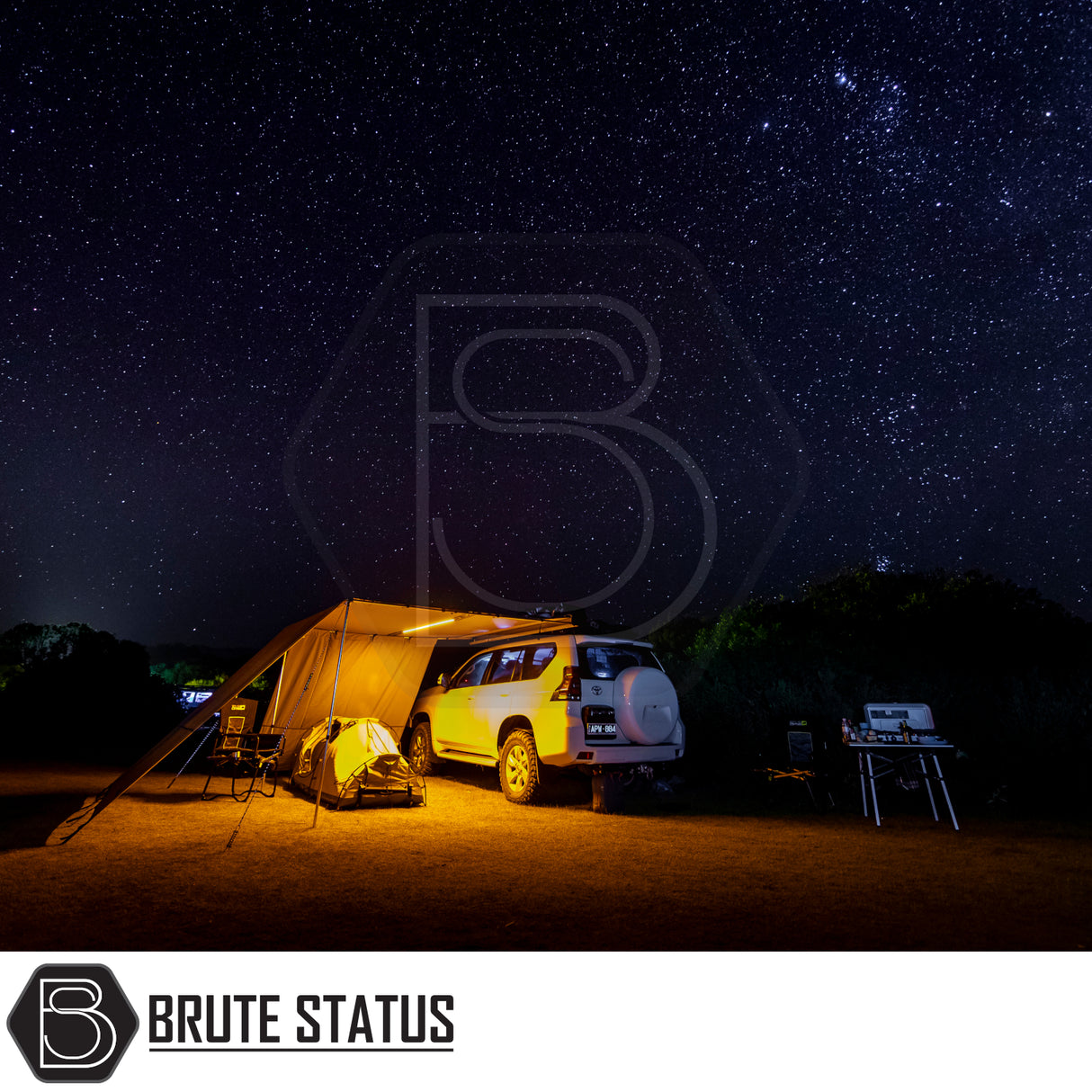 ARB Simpson III Rooftop Tent & Annex on a 4×4 SUV, showcasing a night-time off-road camping setup with awning, tent, chairs, and table under a starry sky.
