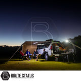 Evening car-camping scene with an SUV featuring the ARB Simpson III Rooftop Tent & Annex, showcasing its practical setup under an illuminated awning.
