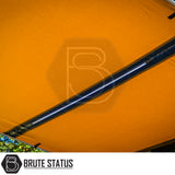 Outdoor retractable awning with orange fabric and central LED light, branded Brute Status, designed for versatile weather protection and storage solutions in camping environments.