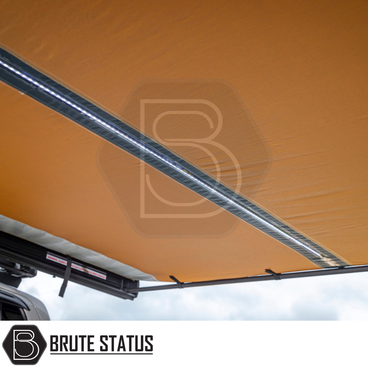 Underneath view of the ARB Aluminium Case Black Awning & LED Light Kit 2m x 2.5m, showcasing its integrated LED strip and mounting hardware.