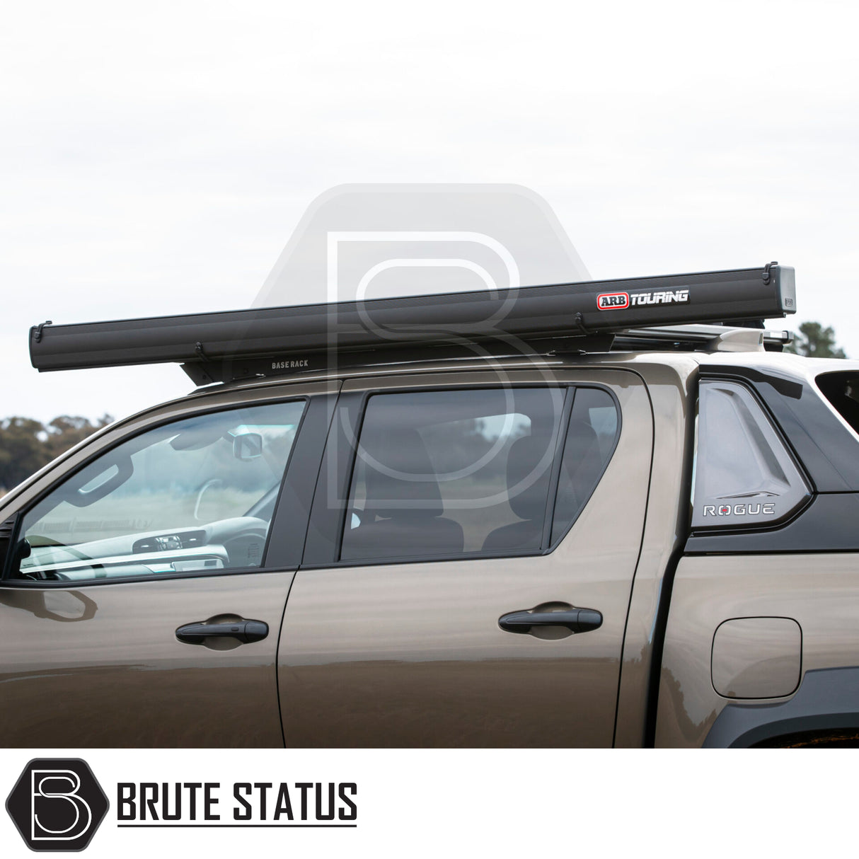 Side view of a pickup with an ARB Awning Alcove on a roof rack, featuring a Brute Status Rogue canopy.