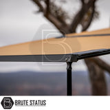Close-up of ARB Awning Alcove with black metal frame and tan fabric, ideal for campers seeking weather protection and extra space, featuring integrated storage and secure setup.