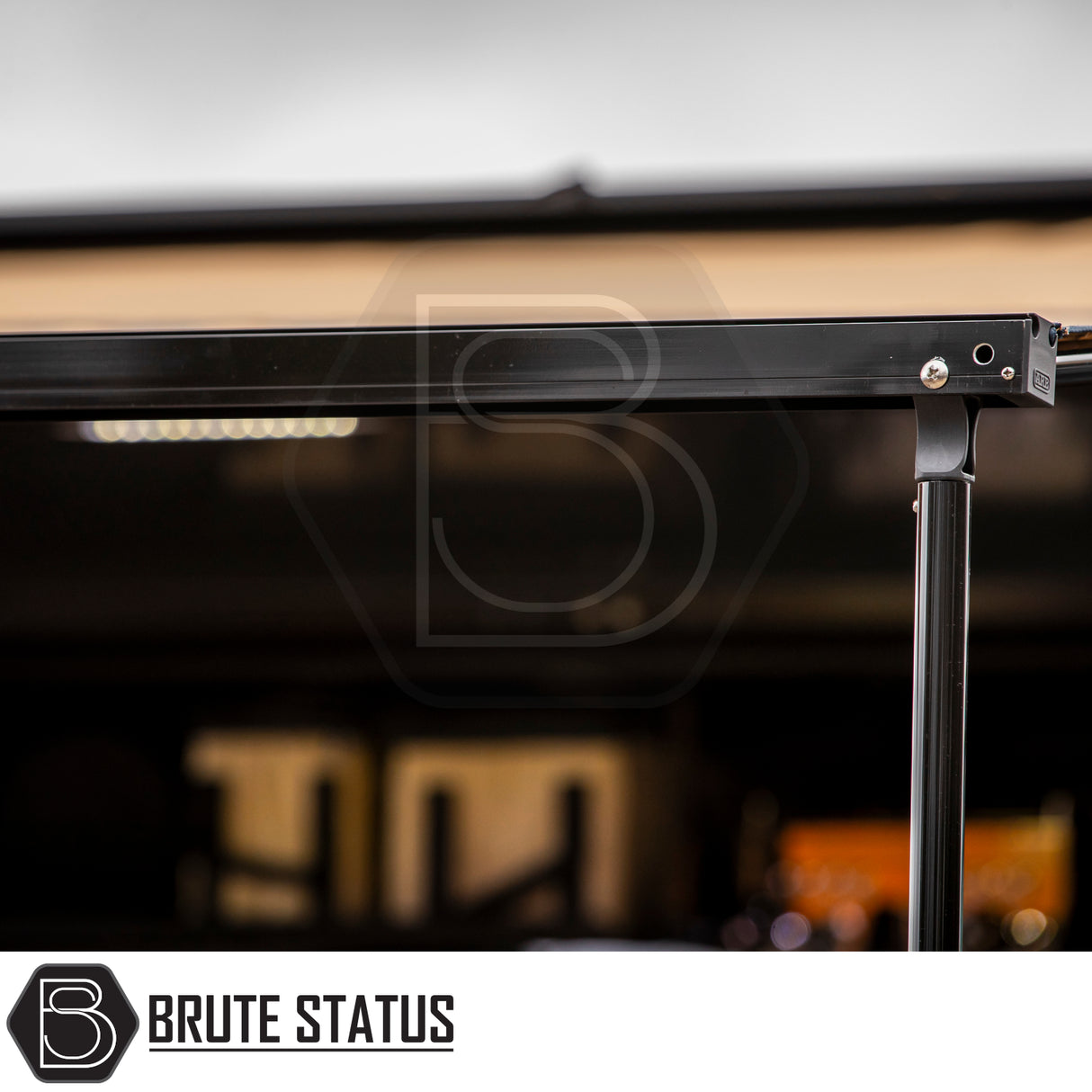 Close-up of ARB Awning Alcove's black powder-coated support beam with LED light strip, essential for off-road vehicle awning systems, enhancing outdoor comfort and protection.