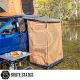 Riverside camping setup with ARB Ensuite Room & Instant Shower Tent attached to a blue 4×4 ute, showcasing a private outdoor shower solution.