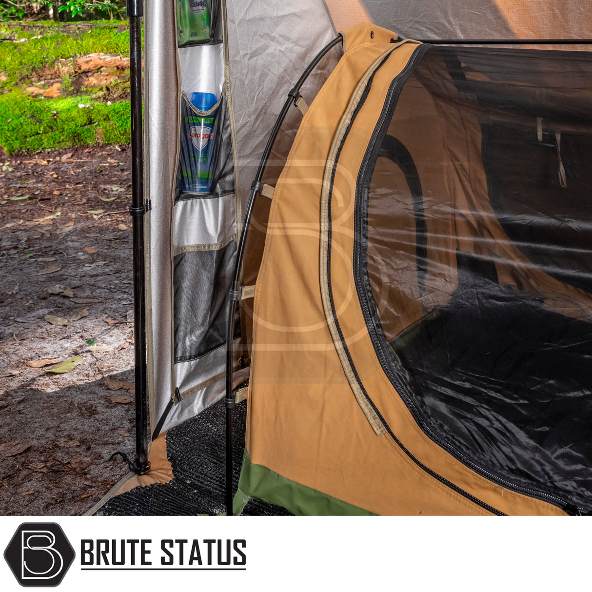 ARB Awning Alcove in a forest setup, featuring a multi-pocket organizer with Kleenex and insect repellent, showcasing its practicality for enhanced camping comfort and convenience.
