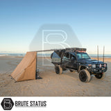 Modified 4x4 truck with ARB PVC Case Awning & LED Light Kit deployed, showcasing a beachside camp setup with protective cover and lighting features.