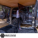 Off-road pickup with ARB Aluminium Case Black Awning & LED Light Kit, featuring a roof-mounted awning and canopy, showcasing enhanced outdoor utility.