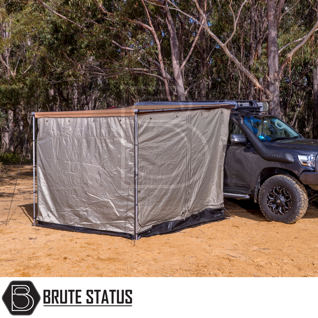 Dark off-road vehicle with ARB PVC Case Awning & LED Light Kit, creating a private camping space beside a eucalyptus grove.