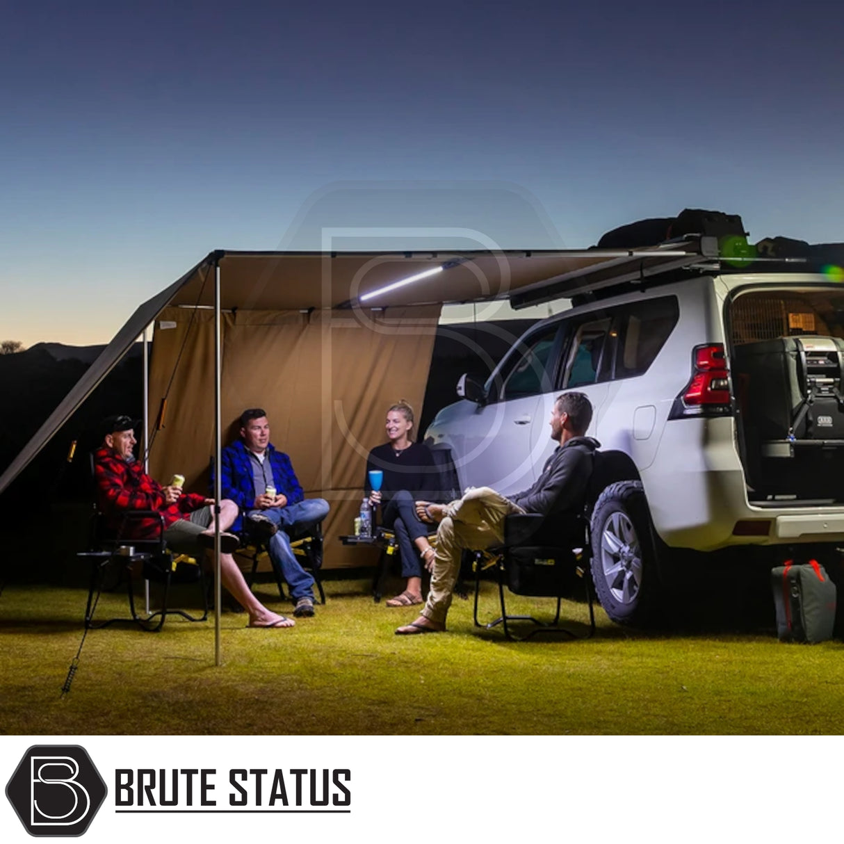 ARB Flinders Rooftop Tent on SUV with awning, campers relaxing underneath. Ideal for compact, comfortable vehicle-based camping.