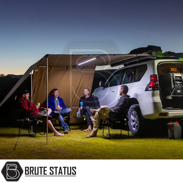 ARB PVC Case Awning & LED Light Kit on SUV, providing shelter with LED lighting for campers at dusk.