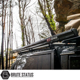 ARB Aluminium Case Awning & LED Kit on 4x4 in wooded area, showcasing its sleek design and practicality for outdoor adventures.