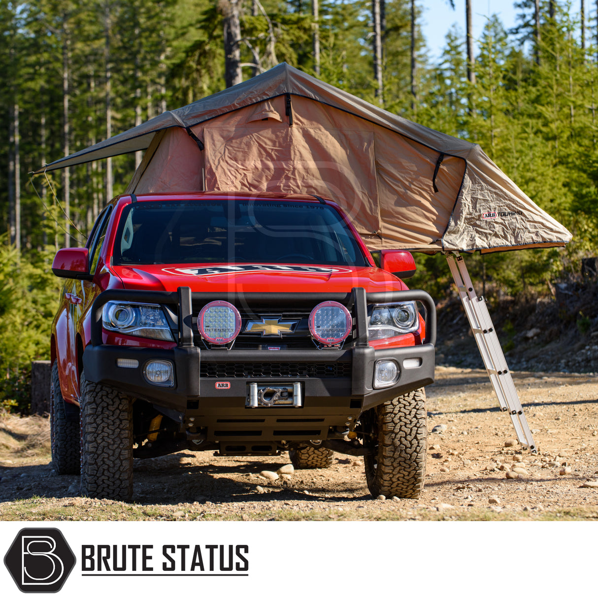Red Chevrolet 4x4 with ARB Simpson III Rooftop Tent, featuring khaki canvas, ladder, and ARB bumper, showcasing Brute Status's rugged aftermarket camping enhancements.