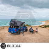 ARB Esperance 2.0 Rooftop Tent on blue Ford Ranger, setup on coastal bluff with campers enjoying the view.