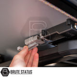 Close-up of a gray Anderson-style DC power connector, part of Brute Status's ARB Esperance 2.0 Rooftop Tent, featuring integrated LED lighting.