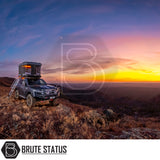 Rugged 4x4 on hilltop with ARB Altitude Rooftop Tent, showcasing automated setup. Ideal for off-grid touring, blending luxury with convenience.