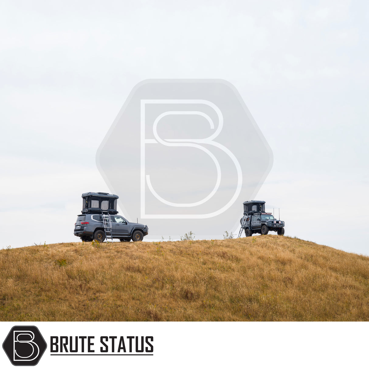 Two off-road SUVs with ARB Altitude Rooftop Tents on a grassy hill, showcasing automated setup and innovative design for luxury off-grid camping.