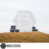 Two off-road SUVs with ARB Altitude Rooftop Tents on a grassy hill, showcasing automated setup and innovative design for luxury off-grid camping.