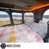 ARB Altitude Rooftop Tent interior with a cozy bed, panoramic mesh windows, LED lighting, and a storage pouch, showcasing luxury camping comfort.