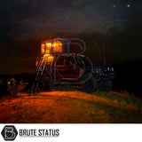 Rugged 4x4 with ARB Altitude Rooftop Tent, illuminated and perched on a hilltop, featuring automated setup and off-road enhancements against a starry night sky.