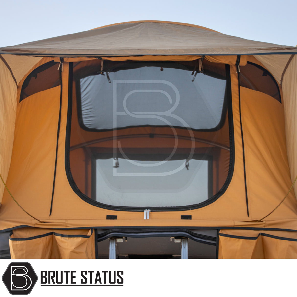 ARB Flinders Rooftop Tent on a pickup, orange canvas, zip-up mesh windows, built-in ladder, designed for easy setup and compact camping for two adults.