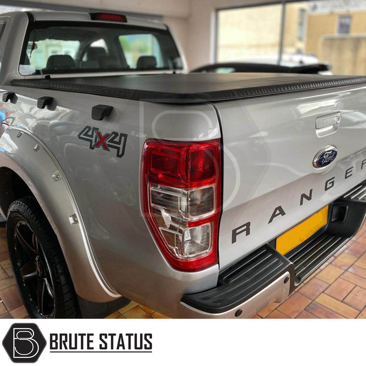 "Premium tri-fold tonneau cover for pickup trucks, featuring UV-stable vinyl, rubber perimeter seals, reinforced corners, and shaped aluminium cross bars for improved durability, aerodynamics, and water resistance. Easy no-drill installation. Not compatible with Wildtrak models with sports bars.