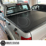 "Premium tri-fold tonneau cover for pickup trucks, featuring UV-stable vinyl, rubber perimeter seals, reinforced corners, and shaped aluminium cross bars for improved durability, aerodynamics, and water resistance. Easy no-drill installation. Not compatible with Wildtrak models with sports bars.