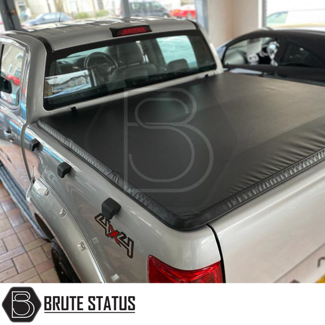 "Premium tri-fold tonneau cover for pickup trucks, featuring UV-stable vinyl, rubber perimeter seals, reinforced corners, and shaped aluminium cross bars for improved durability, aerodynamics, and water resistance. Easy no-drill installation. Not compatible with Wildtrak models with sports bars.