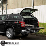 Rear view of Fiat Fullback/Mitsubishi L200 with Truckman Grand Hardtop Canopy, tailgate open, showcasing increased storage and remote locking features.