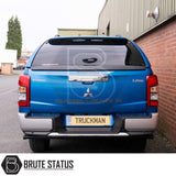Rear view of a Mitsubishi L200 with Truckman Grand Hardtop Canopy, featuring remote locking, tinted windows, and a carpet-lined interior for enhanced storage and security.