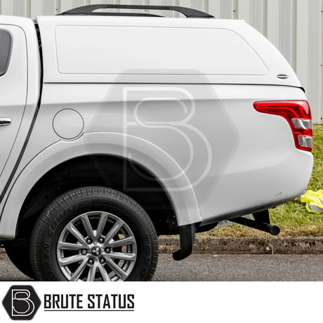Fiat Fullback/Mitsubishi L200 Truckman RS Hardtop Canopy with solid sides and remote locking, fitted on a white pickup truck, showcasing robust and secure design.