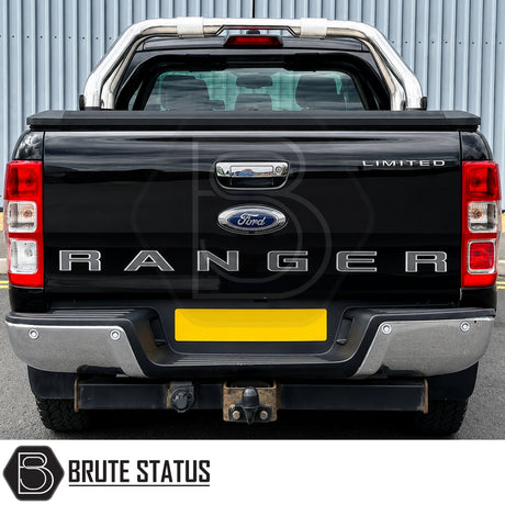 Rear chrome silver metal bumper fitted to black Ford Ranger pickup truck offroad 4x4 vehicle. Suitable for overlanding set ups and compatible with rear parking sensors. 