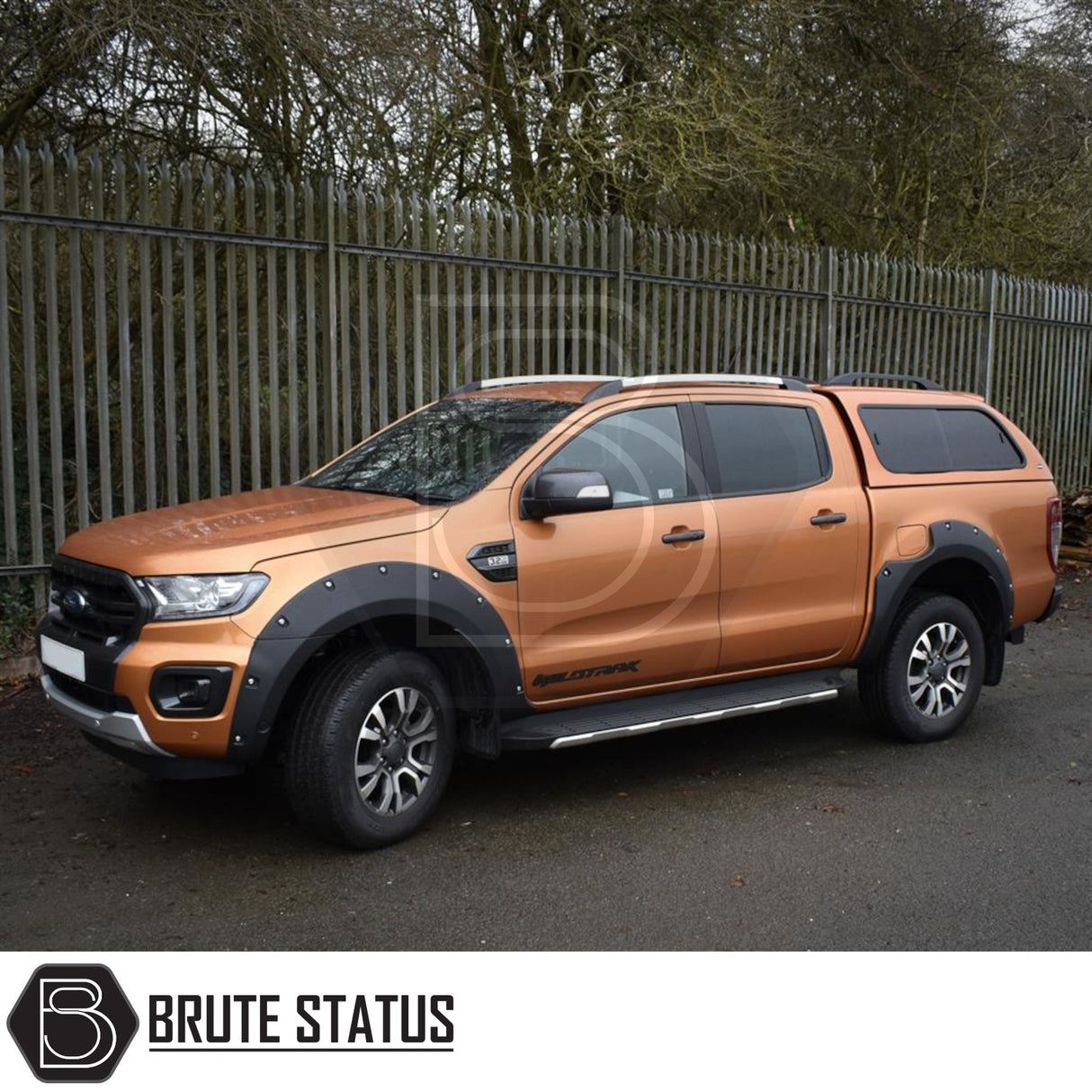 Ford Ranger 2012-2022 Truckman GLS Hardtop Canopy with remote locking and roof bars shown on a Ford Ranger Wildtrak, highlighting its bolt-on wheel-arch flares and rear canopy.