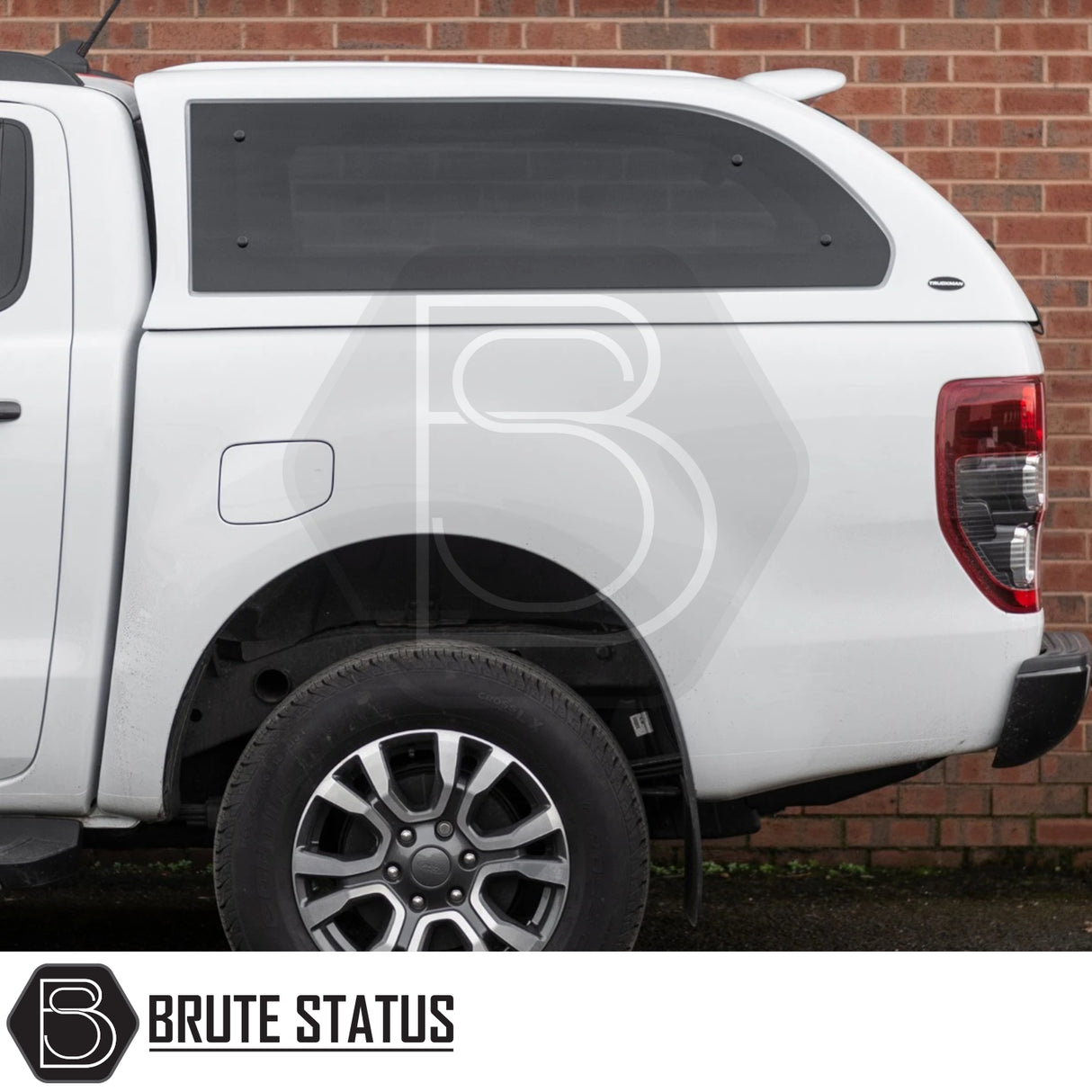 Rear view of white Ford Ranger 2012-2022 with Truckman Grand Hardtop Canopy, featuring tinted side window and Brute Status watermark.