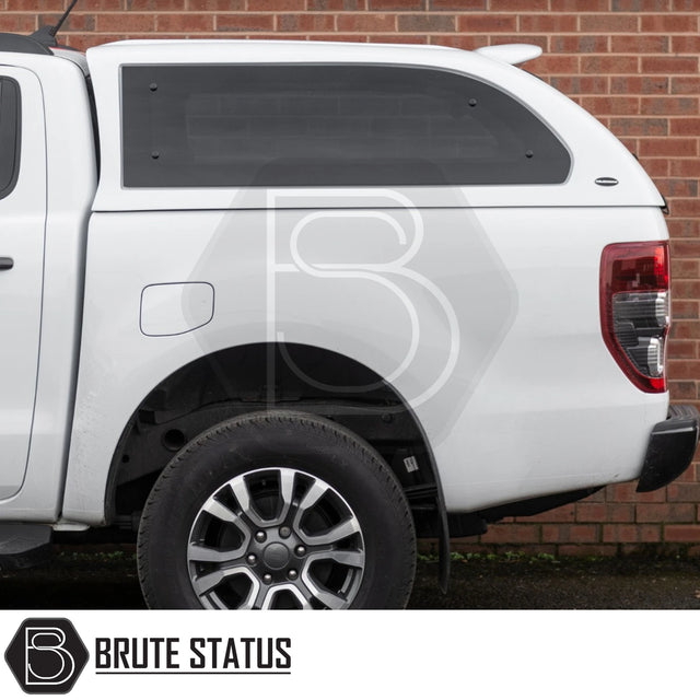 Rear view of white Ford Ranger 2012-2022 with Truckman Grand Hardtop Canopy, featuring tinted side window and Brute Status watermark.
