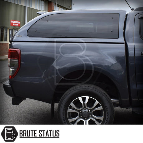 Ford Ranger 2012-2022 Truckman Grand Hardtop Canopy with remote locking, shown on a dark blue pickup, featuring tinted windows and alloy wheel.