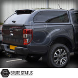 Dark grey Ford Ranger with Truckman Grand Hardtop Canopy, featuring tinted windows and remote locking, enhancing storage and aerodynamics. Brute Status logo visible.
