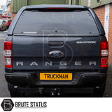 Ford Ranger 2012-2022 Truckman RS Hardtop Canopy with solid rear window on a parked pickup, featuring secure, robust design ideal for commercial use.