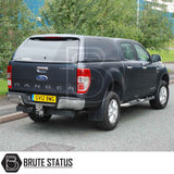 Rear view of a black Ford Ranger fitted with a Truckman RS Hardtop Canopy featuring a solid rear window and tow hitch.