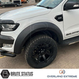 Ford Ranger 2012-2022 Wide Arch Kit (Overland Extreme) in showroom, highlighting premium wide wheel arches and large tires, emphasizing durability and precision design.