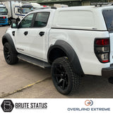 Ford Ranger 2012-2022 Wide Arch Kit (Overland Extreme) in showroom, highlighting premium wide wheel arches and large tires, emphasizing durability and precision design.