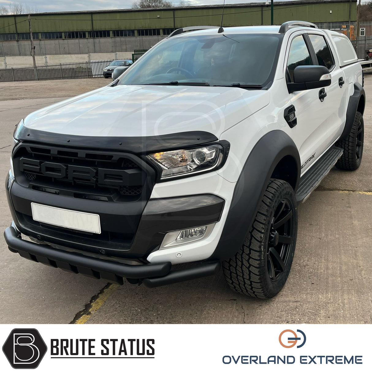 Ford Ranger 2012-2022 Wide Arch Kit (Overland Extreme) in showroom, highlighting premium wide wheel arches and large tires, emphasizing durability and precision design.