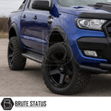 Front and rear smooth matte black wheel arch kit fitted to blue Ford Ranger pickup truck offroad 4x4 vehicle with upgraded alloys. 